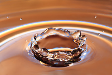 Image showing Yellow Water Drop Splashing with Waves