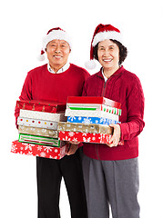 Image showing Senior Asian couple celebrating Christmas