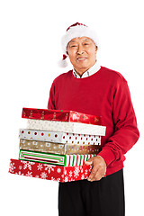 Image showing Senior Asian celebrating Christmas