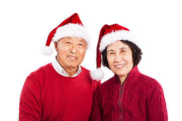 Image showing Senior Asian couple celebrating Christmas