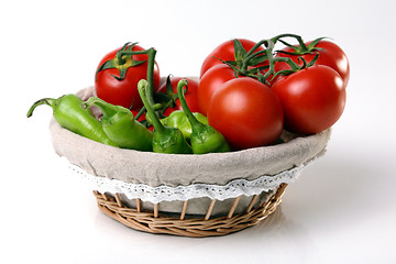 Image showing Red tomatoes in basket with green peperoni