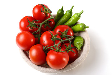 Image showing Red tomatoes and green peperoni in basket