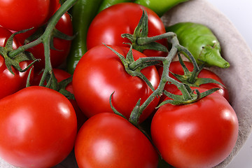 Image showing Close up of red tomatoes and green peperoni