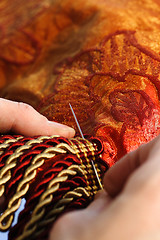 Image showing Craftsman working on a curtain