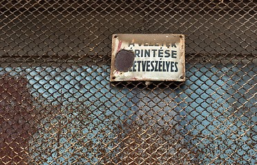 Image showing Danger! High voltage sign on metal fence