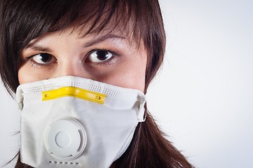 Image showing girl wearing protective mask against white background