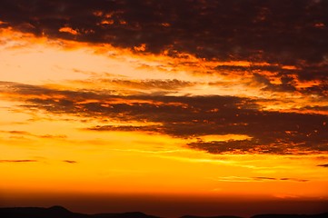 Image showing Orange sunset with clouds 