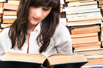 Image showing Young student learning from a book