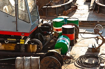 Image showing Oil cans on rusty metal surface