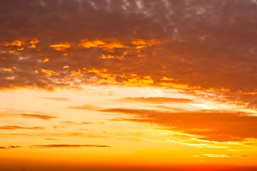 Image showing Orange sunset with clouds