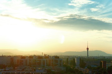 Image showing Sunset with old city and and tower