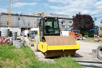 Image showing Orange road-roller at construction site