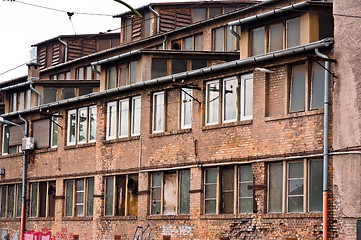 Image showing Abandoned industrial building with brick wall