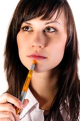 Image showing Young business woman thinking against isolated background