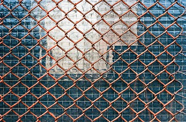 Image showing Metal fence on closed down building