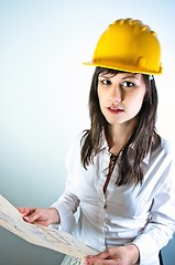 Image showing An architect woman holding plans