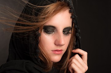 Image showing Black makeup and hood on a beutiful young girl