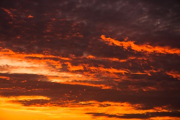 Image showing Red sky with several storm clouds