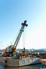 Image showing A big crane on boats in a construction