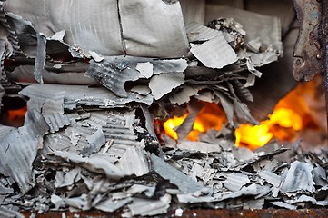 Image showing Flame burning in barrel with papers