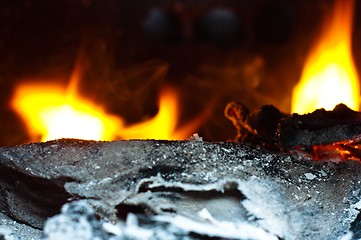 Image showing Trash burning in black barrel