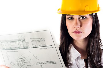 Image showing Pretty business woman in yellow helmet and her plans