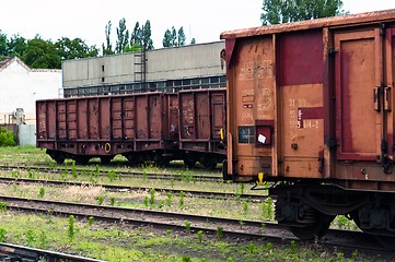 Image showing Old trains in a trainyard 