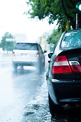 Image showing Close up of a car in the rain with blurry background