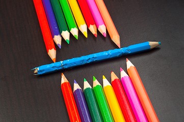 Image showing Monster made out of pencils on black board