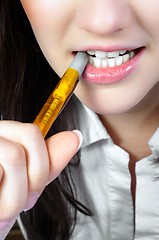 Image showing Woman Chewing on a Pencil