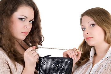 Image showing Quarrel of two beautiful girls because of a handbag