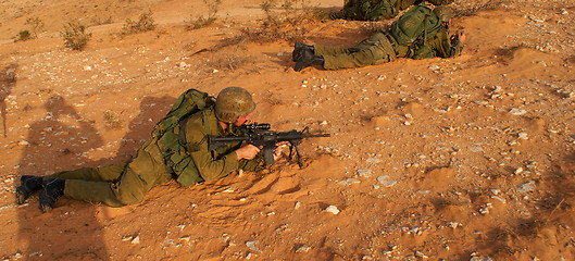 Image showing Israeli soldiers excersice in a desert