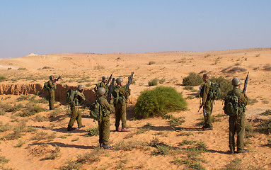 Image showing Israeli soldiers excersice in a desert