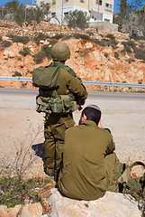 Image showing Israeli soldiers patrol in palestinian village