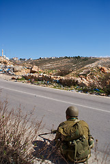 Image showing Israeli soldiers patrol in palestinian village