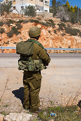 Image showing Israeli soldiers patrol in palestinian village