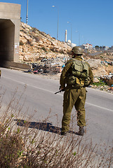 Image showing Israeli soldiers patrol in palestinian village