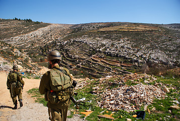 Image showing Israeli soldiers patrol in palestinian village