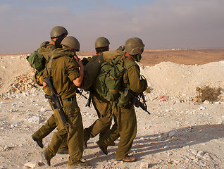 Image showing Israeli soldiers excersice in a desert