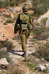 Image showing Israeli soldiers patrol in palestinian village