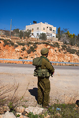 Image showing Israeli soldiers patrol in palestinian village