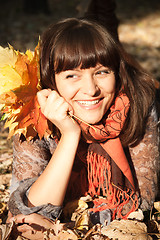 Image showing woman with autumn leaves