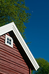 Image showing Detail of red log cabin