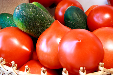 Image showing Foto of cucumber and tomatoes laying nearby