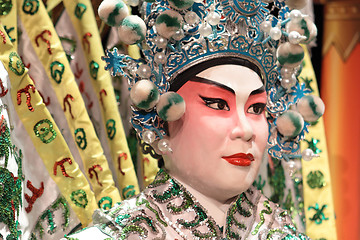 Image showing chinese opera dummy and red cloth as text space ,it is a toy,not