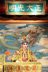 Image showing chinese opera dummy and red cloth as text space ,it is a toy,not