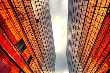 Image showing Skyscrapers with clouds reflection 