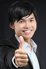 Image showing portrait of young man in suit and thumbs up