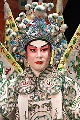 Image showing chinese opera dummy and red cloth as text space ,it is a toy,not