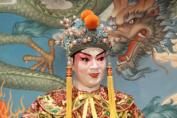 Image showing chinese opera dummy and red cloth as text space ,it is a toy,not